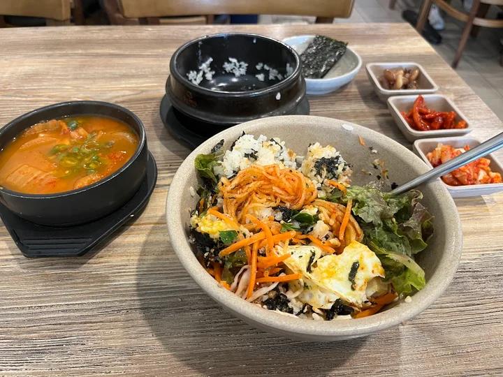 Fresh Korean-style grain bowl with vegetables, eggs, and house-made ingredients