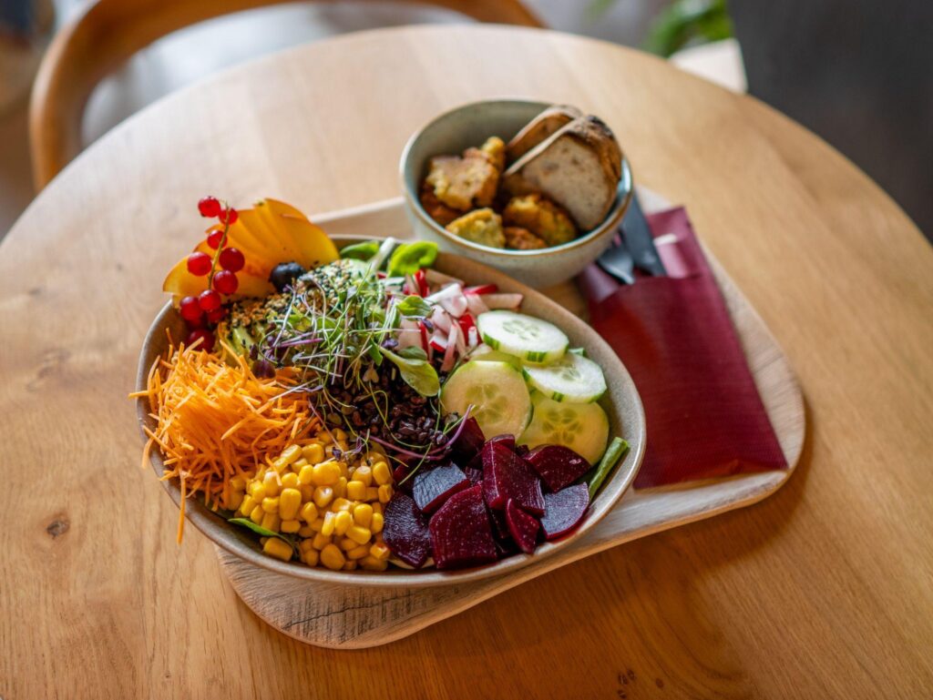 Colourful healthy lunch bowl made with fresh vegetables, grains, and wholesome ingredients